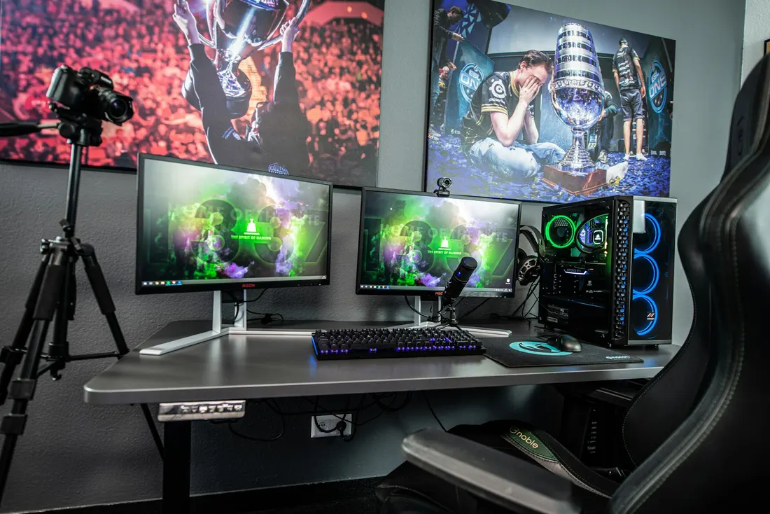 Content studio with a camera on a tripod in front of editing monitors
